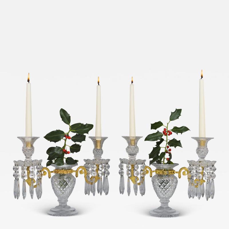 AN UNUSUAL PAIR OF REGENCY ORMOLU MOUNTED CUT GLASS CANDELABRA