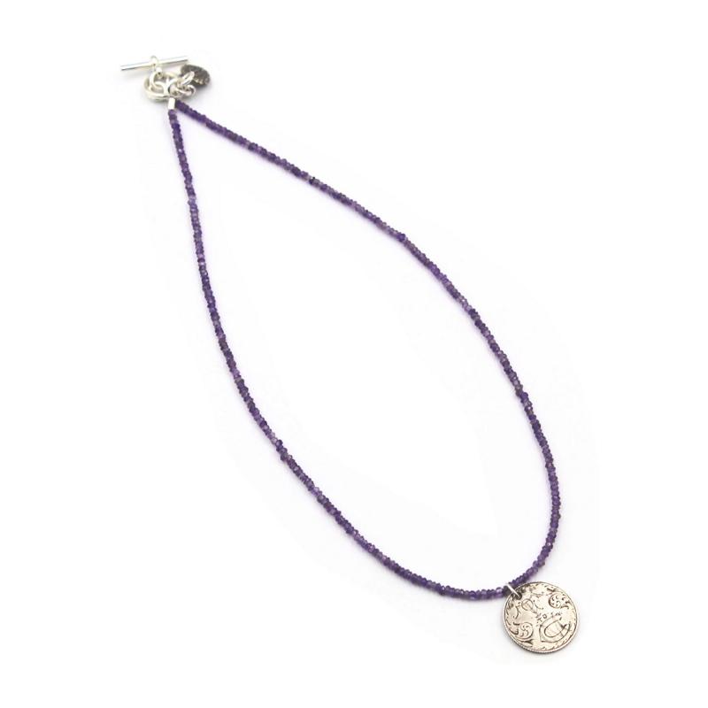 ANTIQUE LOVE TOKEN ON A FACETED AMETHYST NECKLACE