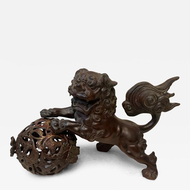 ANTIQUE PATINATED IRON FOO DOG WITH GILT BALL WITH FLOWERS SCULPTURE