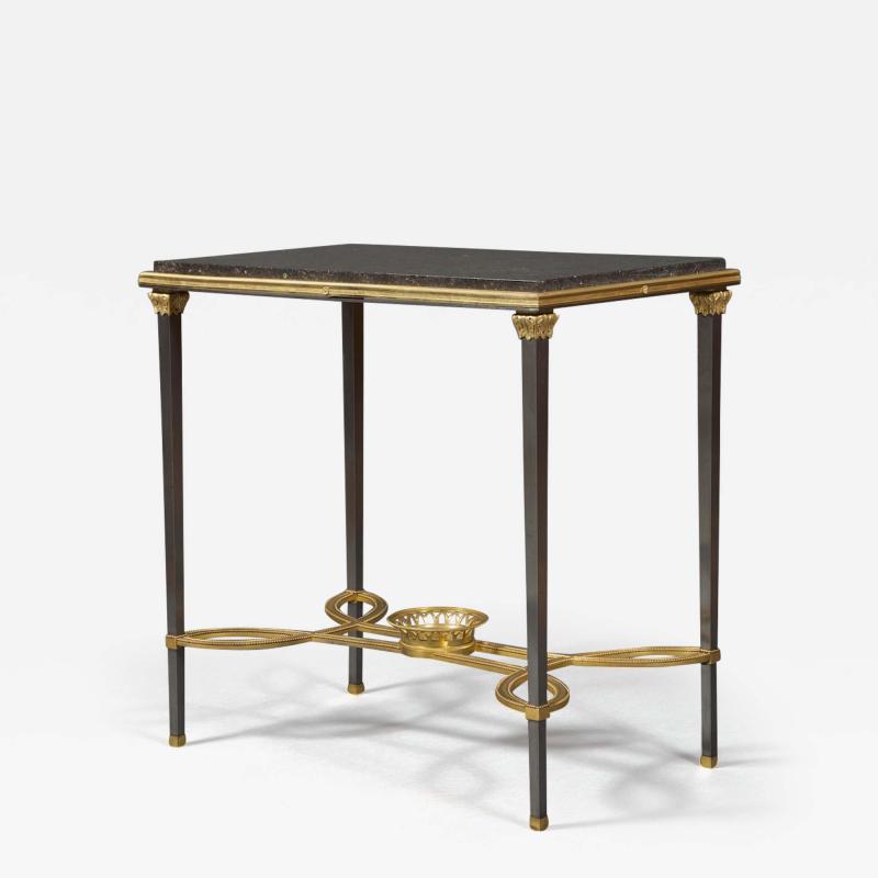 Adam Weisweiler AN EXQUISITE STEEL AND GILT BRONZE CENTER TABLE WITH FOSSIL MARBLE TOP