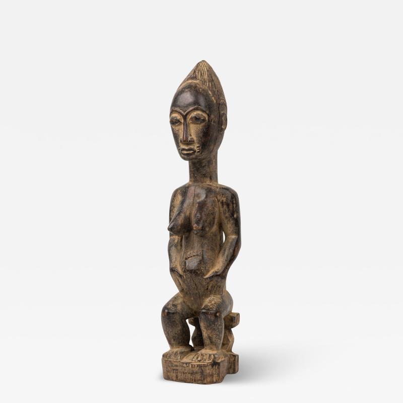 African Ivory Coast Late Carved Wood Baule Seated Female Fertility Figure