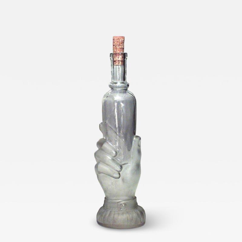 American Victorian glass decanter of hand holding small bottle