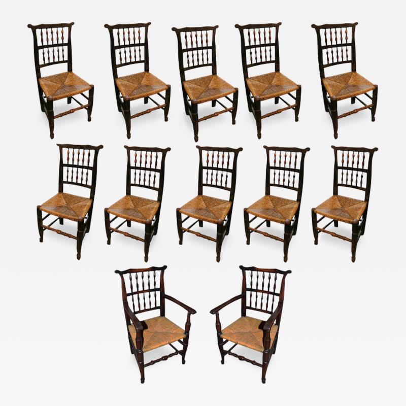 An 18th Century English Elmwood Set of Ten Side and Two Arm Spindle Back Chairs