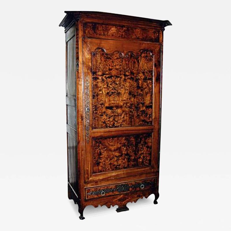 An 18th Century French Louis XV Elm and Cherry wood Bonnetiere