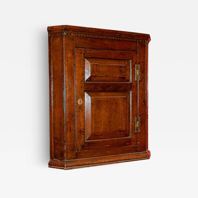 An 18th Century Mid Georgian Oak Hanging Corner Cupboard