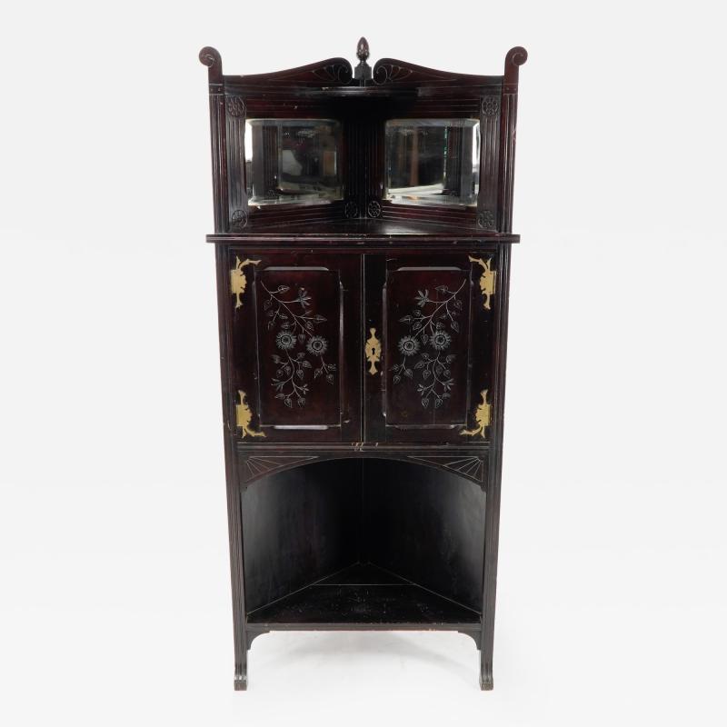 An Aesthetic Movement Mahogany Corner Cabinet with Incised Floral Decoration