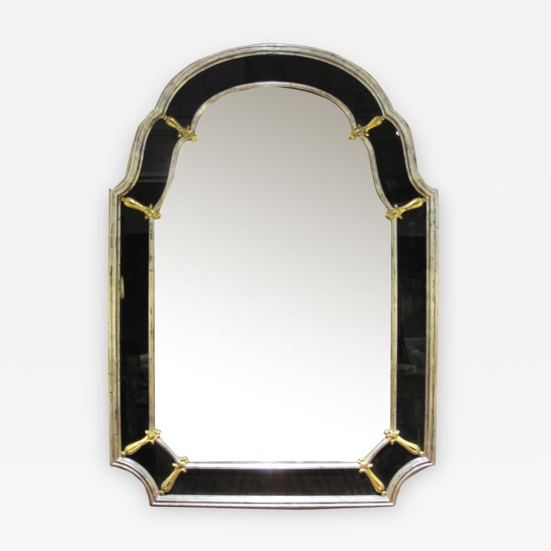 An American Hollywood regency silver gilt wood mirror with black glass border