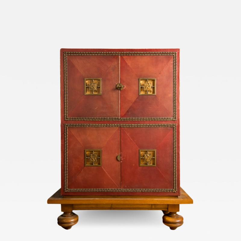 An Art Deco cabinet in deep red leather by M Claude Renard circa 1930 