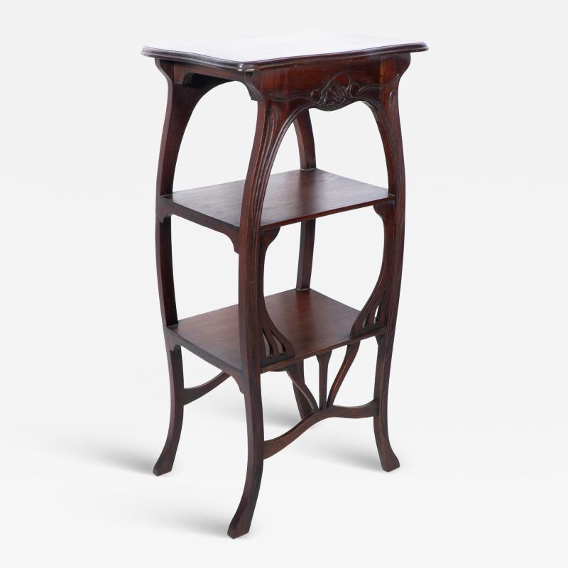 An Art Nouveau Mahogany Three Tier Plant Stand with Shallow Floral Carving
