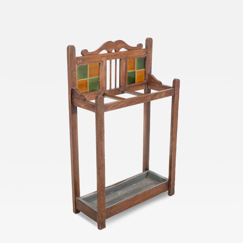 An Arts Crafts Oak Umbrella Stick Stand with Original Green Mustard Tiles