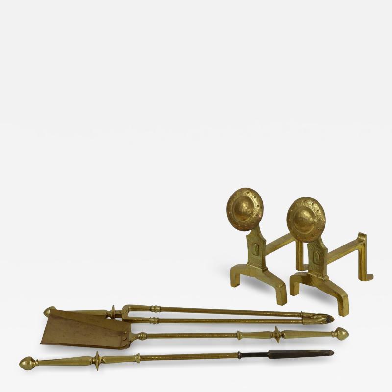 An Arts Crafts Set of Brass Fire Dogs Matching Utensils