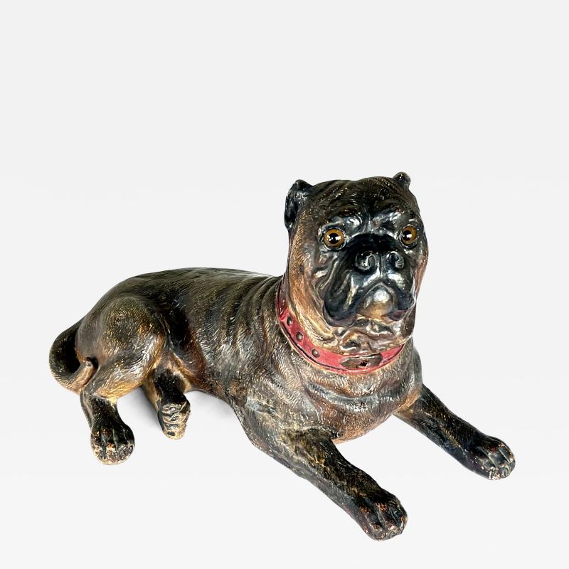 An Austrian painted terracotta model of a recumbent bull dog