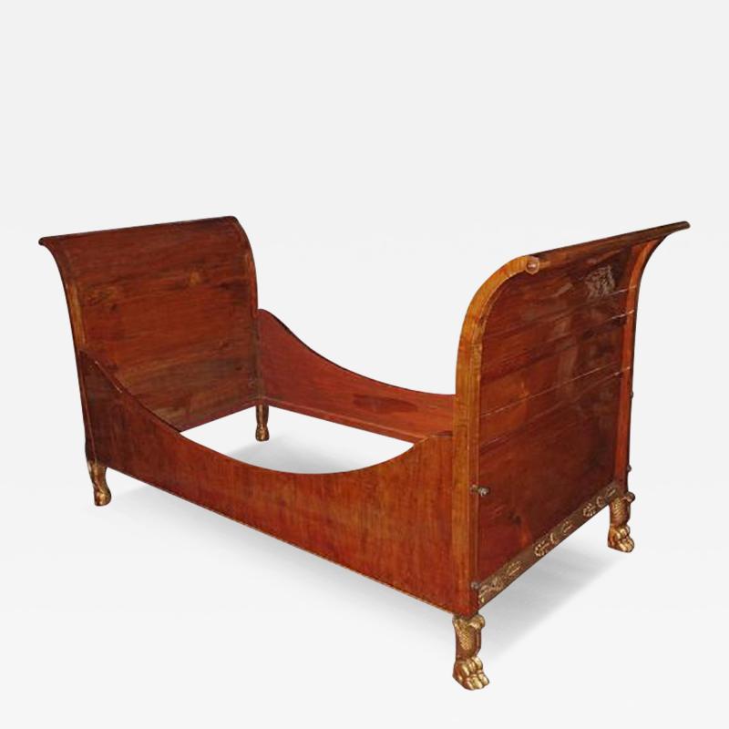 An Early 19th Century Italian Empire Walnut Lit en Bateau Bed