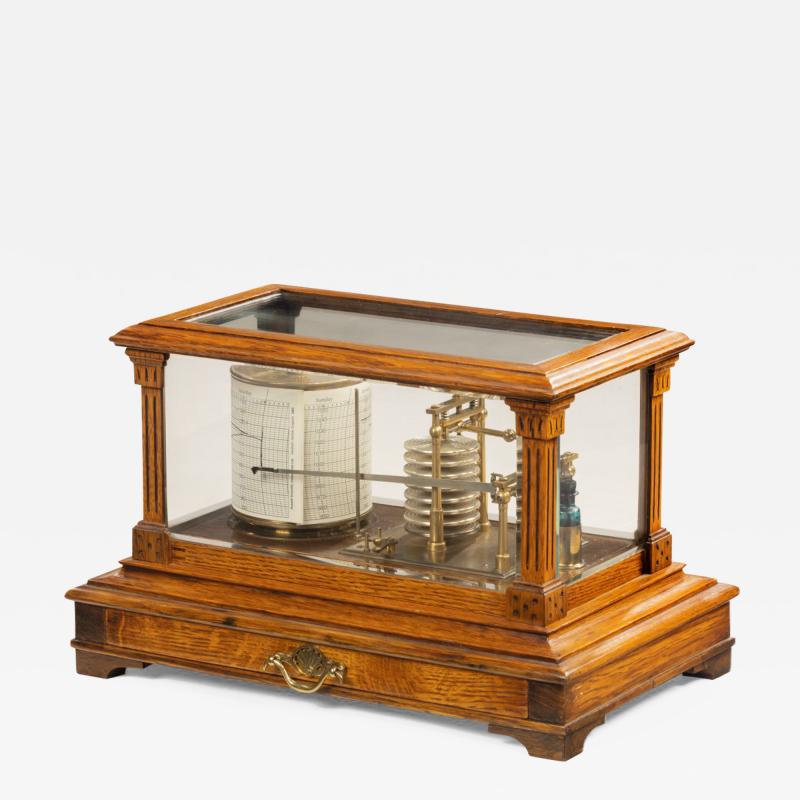 An Edwardian cased oak barograph with bevelled glass panels