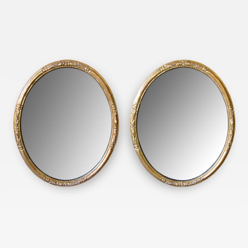 An Elegant Pair of French Napoleon III Carved Gilt Wood Oval Mirrors
