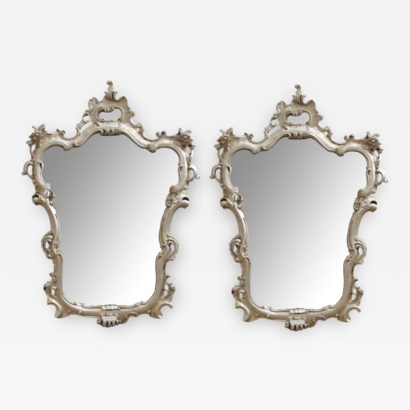 An Elegant Pair of Italian Rococo Style Silver Leafed Gilt Wood Mirrors