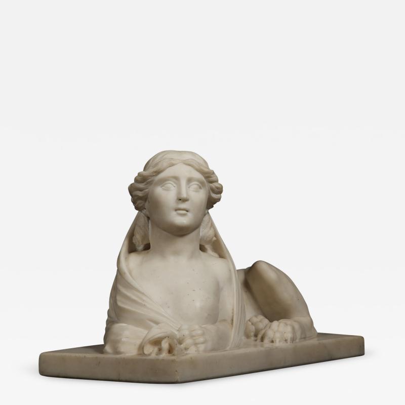 An Imposing Carved Statuary Marble Sculpture Of A Reclining Veiled Female Sphinx
