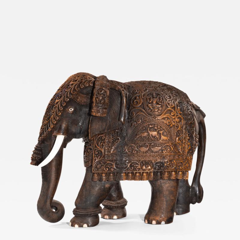 An Indian carved hardwood elephant