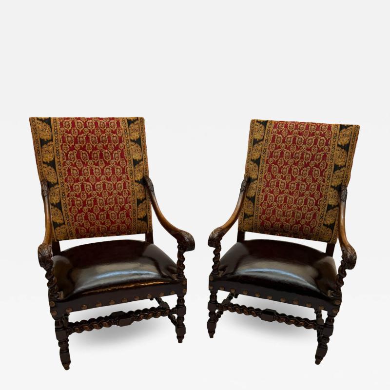 An Italian pair of Walnut armchairs with leather seats and fabric backs 