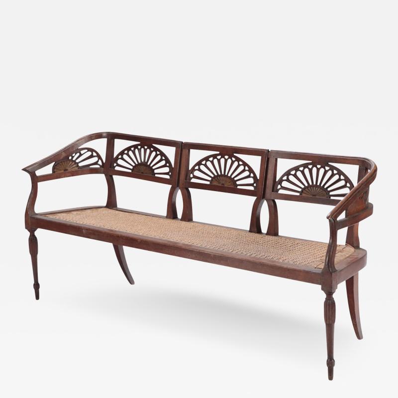 An Italian walnut sofa with cord seat cutout design Circa 1800 