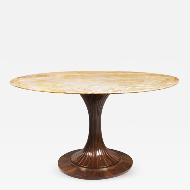 An Oval Pedestal Table by ILIAD Design