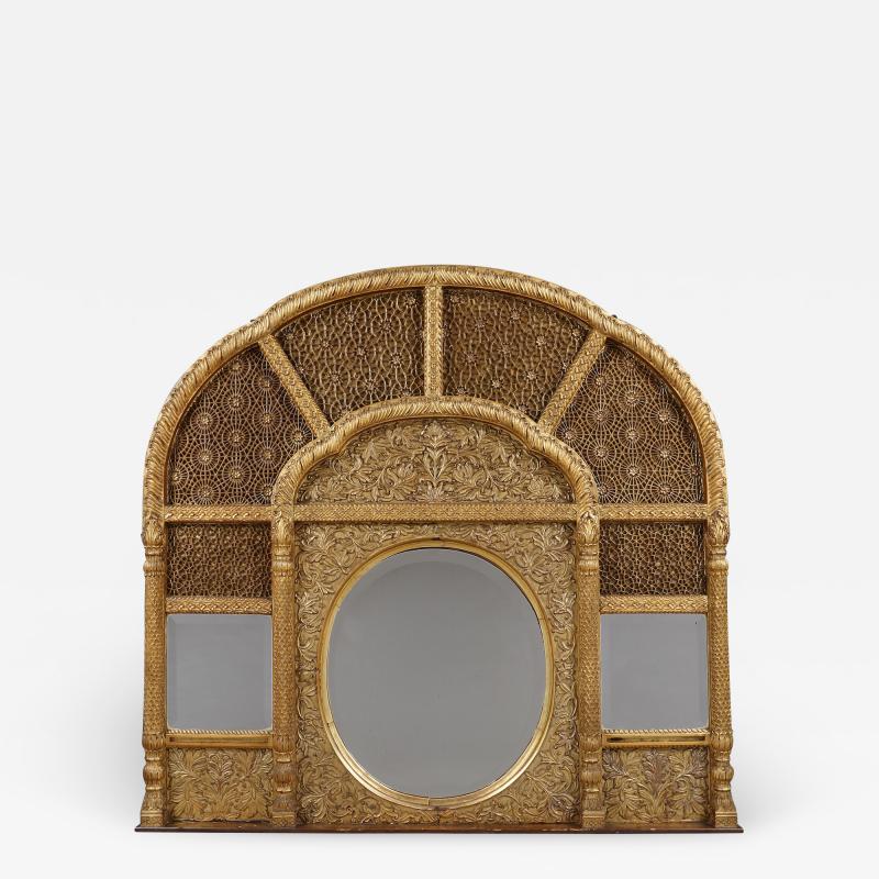 An Overmantel Mirror With Panels Of Mughal Inspired Carved Geometric Tracery