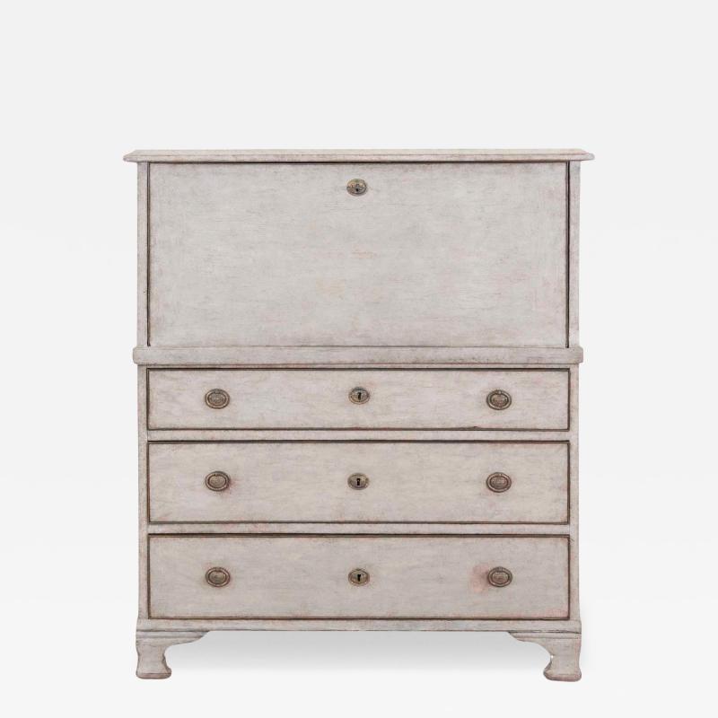 An antique Swedish bureau in antique white