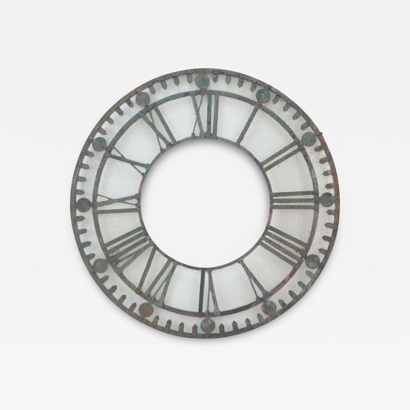 An early 20th C cast iron and glass clock face ornament circa 1900 