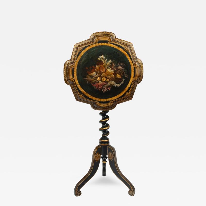 An early Victorian black and gilt papier m ch occasional table
