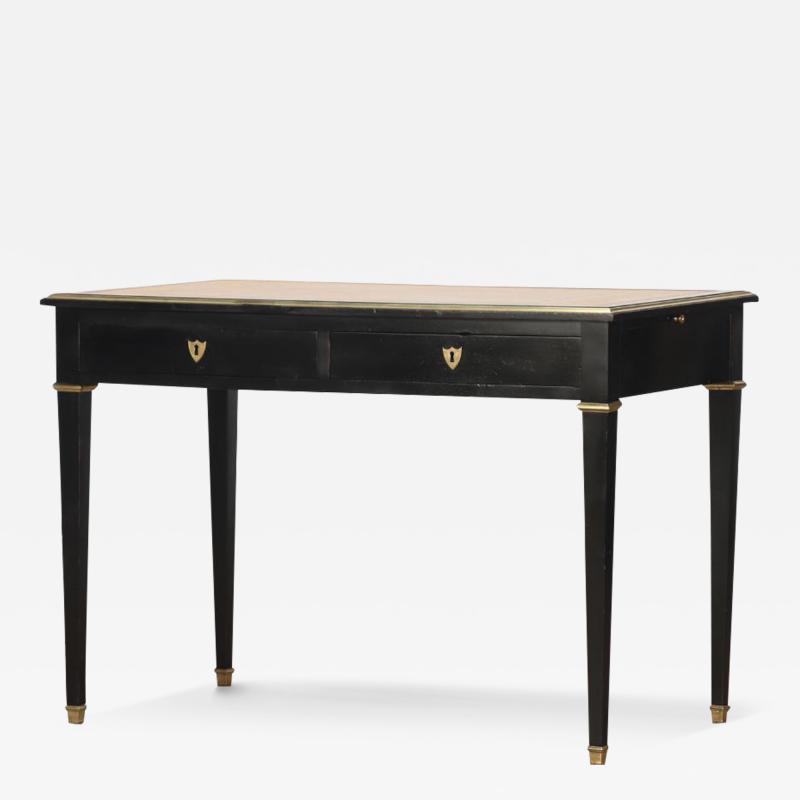 An elegant French leather top ebonized desk C 1940 