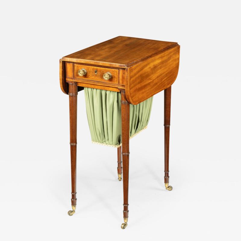 An elegant George III mahogany Pembroke sewing table