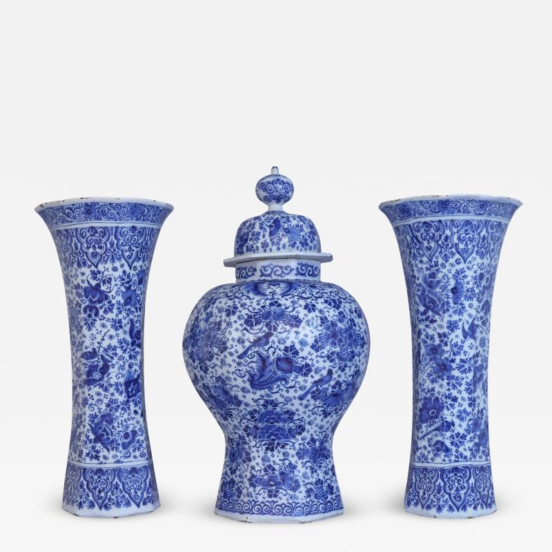 An important and large Dutch Delft garniture set of three vases