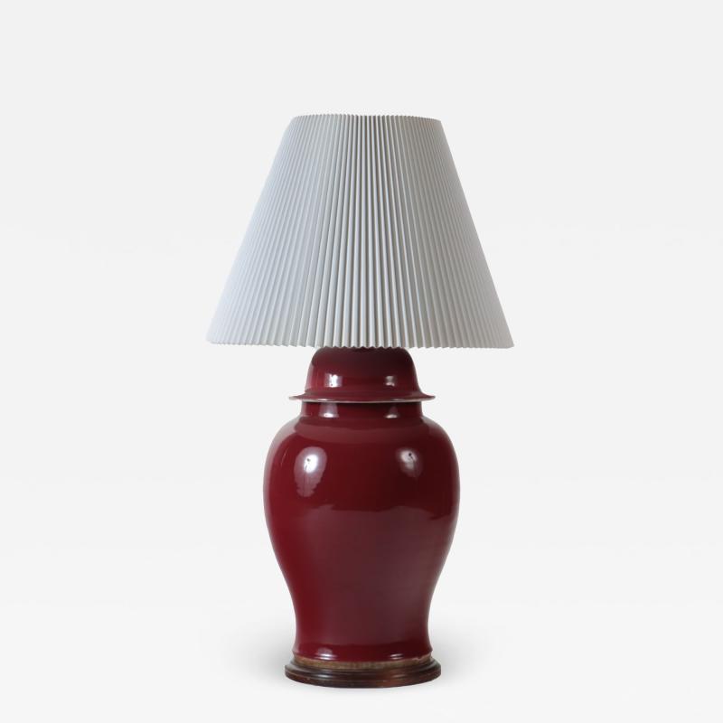 An oxblood vase table lamp on wooden base circa 1970s