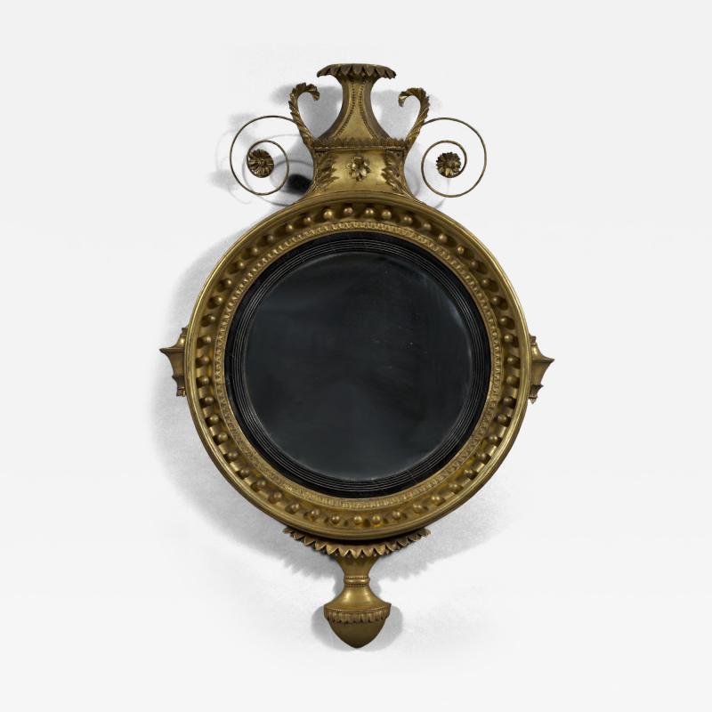 An unusual Regency giltwood convex mirror