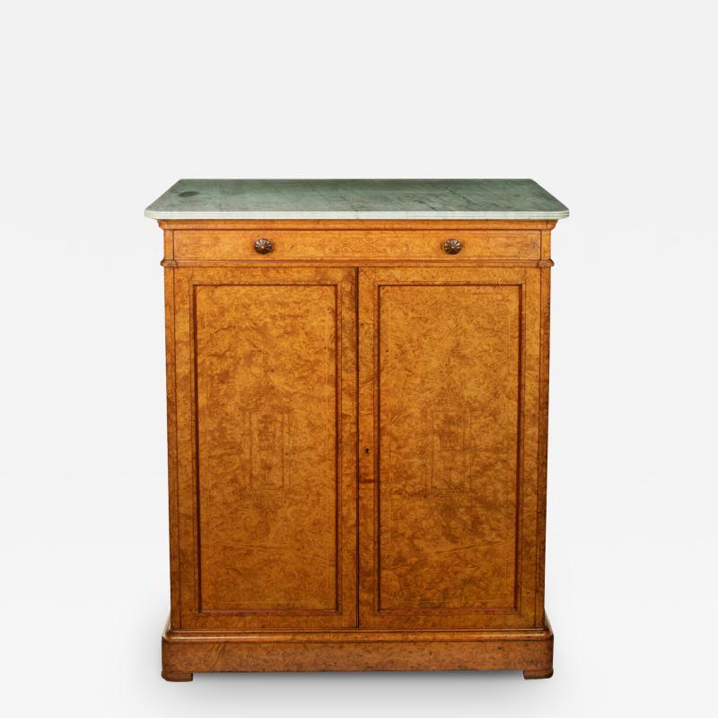 An unusual amboyna cupboard by Gillow Co