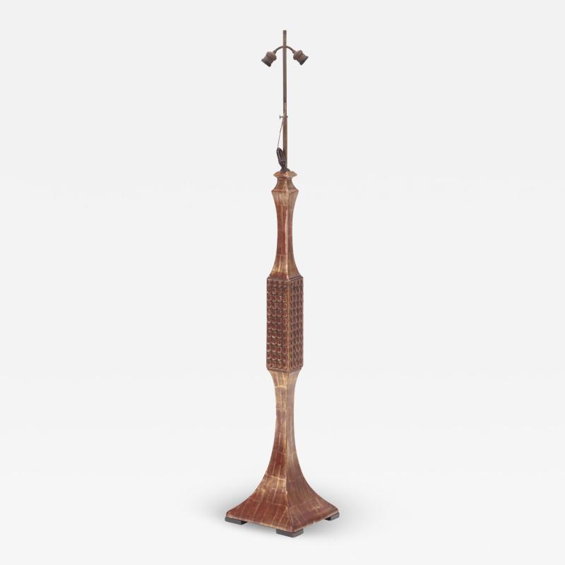 An unusual carved and gilt wood floor lamp circa 1950 