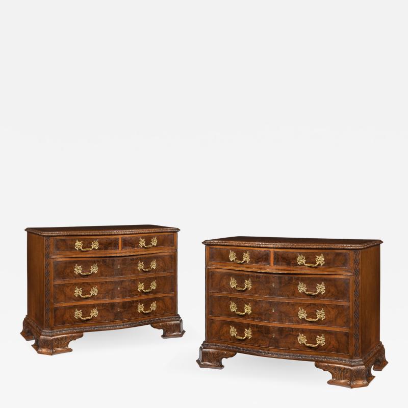 An unusual pair of early 20th century walnut serpentine commodes