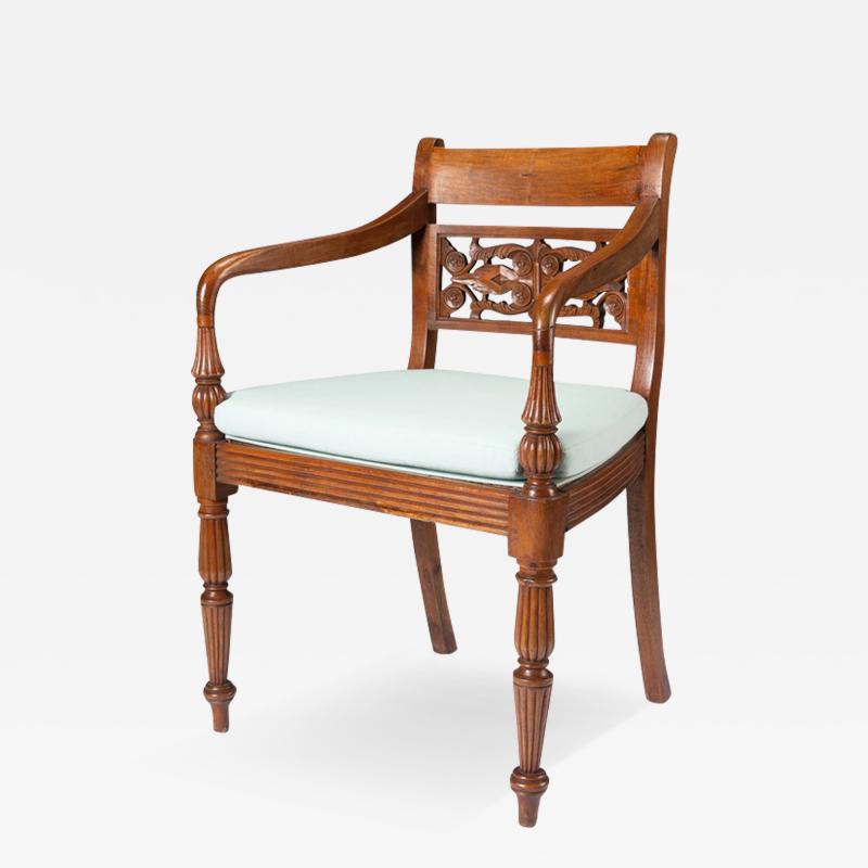 Anglo Indian teak arm chair with caned seat and cushion 1900 50 