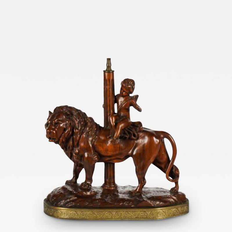 Antique Carved Wood Treen Sculpture of Cherub Riding a Lion Now a Table Lamp