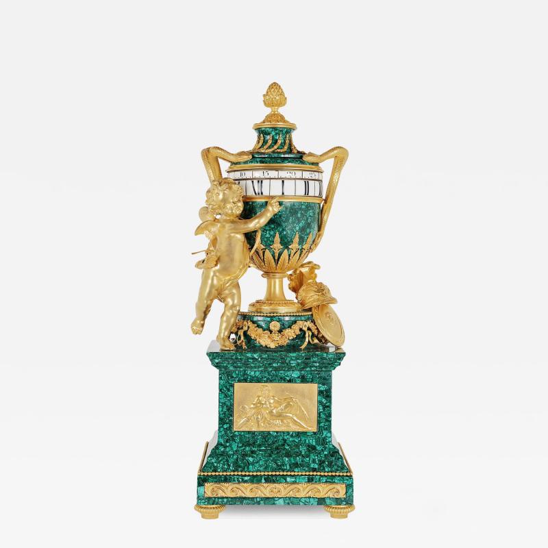 Antique French gilt bronze mounted malachite turning mantel clock