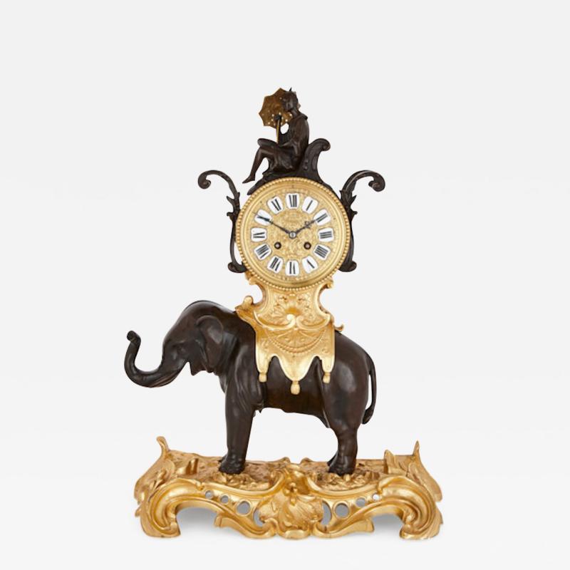Antique Louis XV style patinated and gilt bronze clock