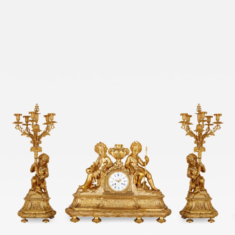 Antique Neoclassical style three piece gilt bronze clock set