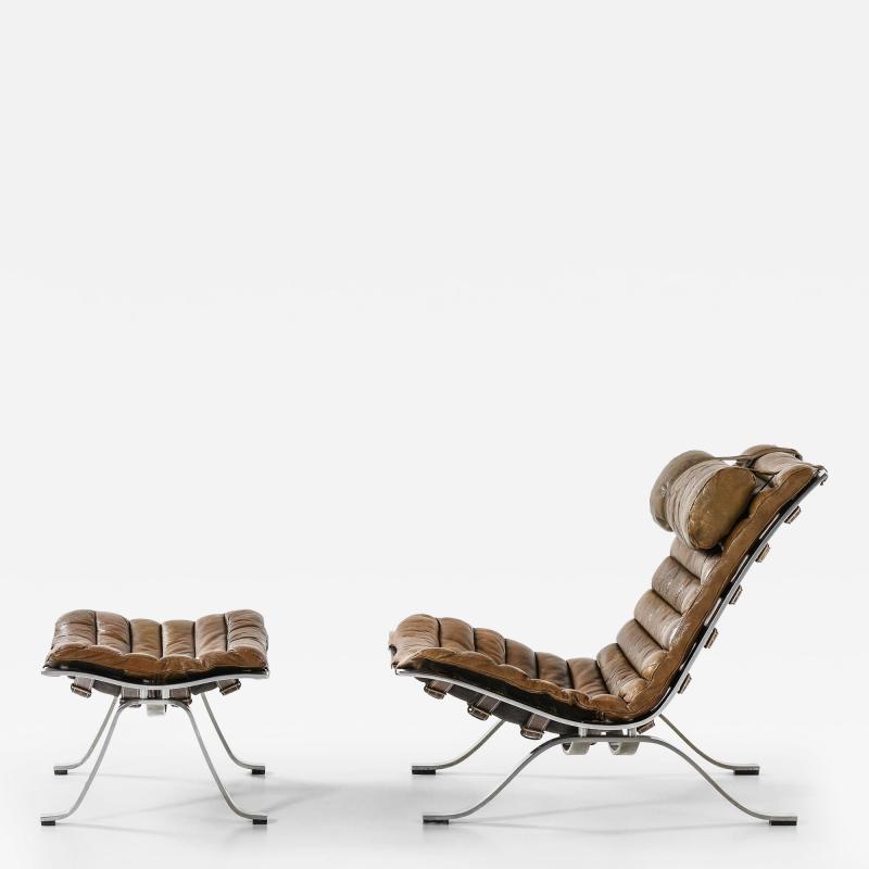 Arne Norell Easy Chair in Leather and Steel with Stool by Arne Norell 1970s