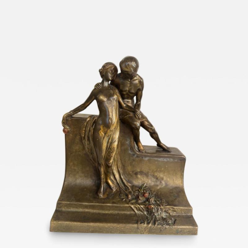 Art Deco bronze group of standing semi nude lady and seated man embracing