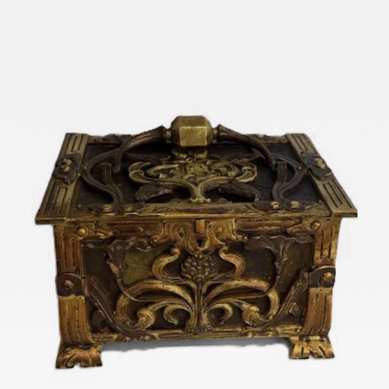 Art Nouveau brass and copper box with head and green velvet interior
