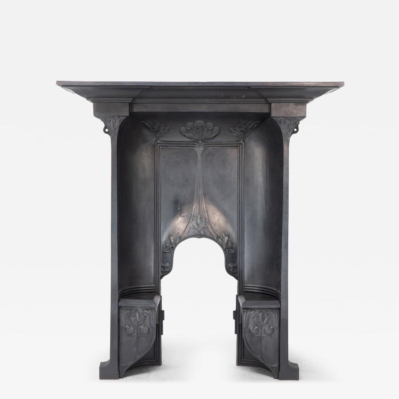 Arts Crafts cast iron fireplace with curved sides stylized floral decoration