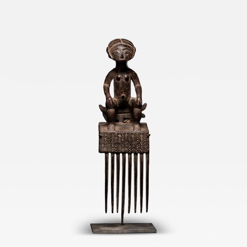 Ashanti Comb representing Female sitting Figure Ghana