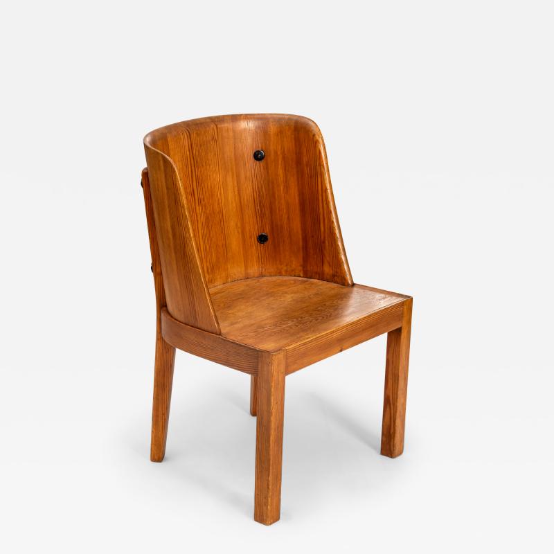 Axel Einar Hjorth Lovo armchair stained pine and iron rivets