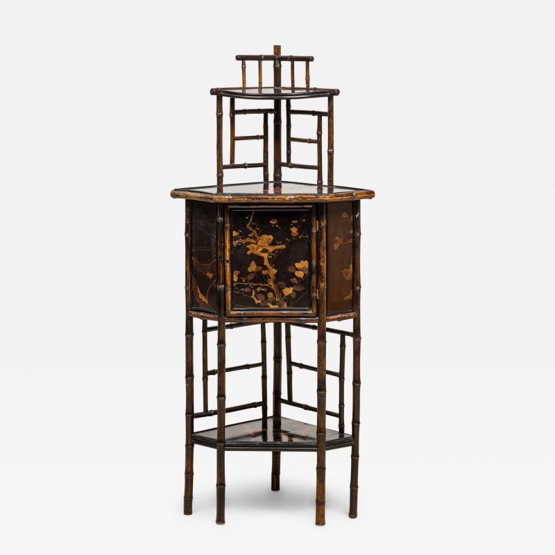 Bamboo and black lacquered decorated corner cabinet with door