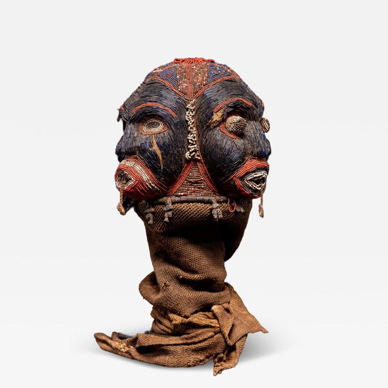 Bamileke Triple Cult head embroidered with dark blue European Glassbeads